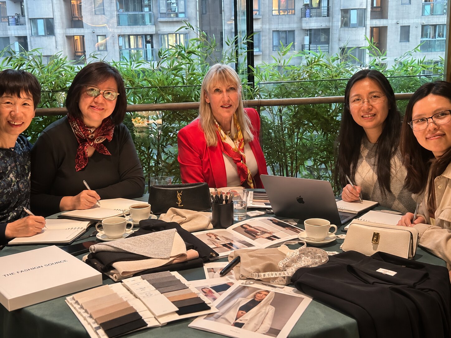 Penny, Eva, Dana and Amy from our Shanghai design team reviewing fabric samples and mood boards